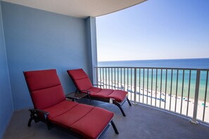 Two loungers on oversized balcony overlooking Gulf