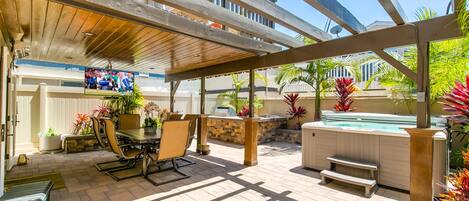 Entertainer's patio with built in BBQ, hot tub, fireplace/water feature and TV.