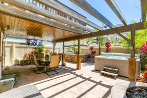 Entertainer's patio with built in BBQ, hot tub, fireplace/water feature and TV.