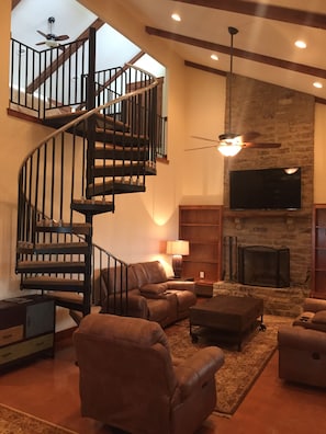 Soaring ceilings and massive fireplace
