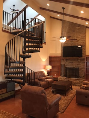 Soaring ceilings and massive fireplace 