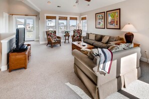 The upper level great room offers plenty of seating for your family to gather in comfort.