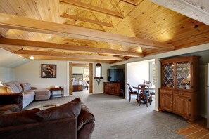 Spacious and open living area - open to dining, and kitchen. Beyond are double doors leading to bedroom.

-There are roughly 10 steps/stairs to get up to the unit