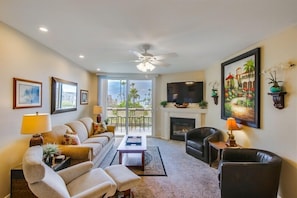 The inviting ocean view living room is a great place to unwind after a day in the surf and sun.