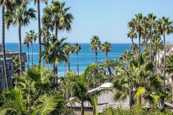 Straight on west-facing views are yours to enjoy from the living room and its balcony!