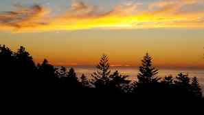 Our spectacular ocean view at sunset from the living room and deck!
