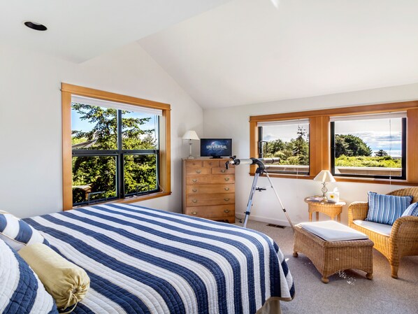 King bedroom #1 with a peek-a-boo view of water.