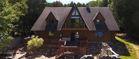 This Stunning Log House is built beside an old barn foundation ...