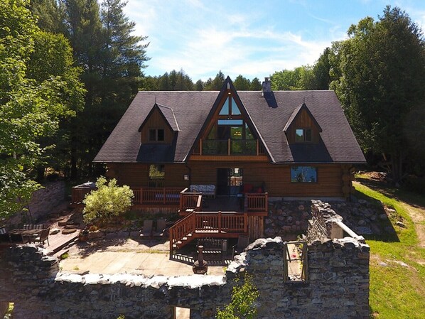 This Stunning Log House is built beside an old barn foundation ...