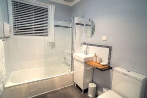Updated bathroom with shower over bath