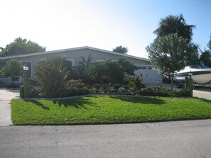 Front of home Private 
with circular driveway. 