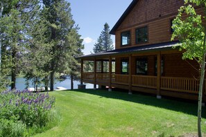 View of the home, lake, and some of the grounds.
