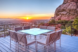 Balcony table seating 8 people for a breathtaking outdoor dining experience