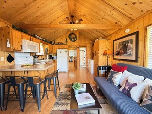 Upon entrance there is a view of the kitchen and living room area.