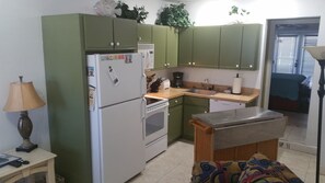 Full Kitchen with rolling island.  