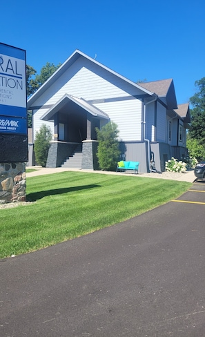 You have a grass area out front and to the south. You also have a large parking lot in the back and to the north side.