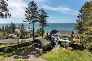 Welcome to this gorgeous, 2400 sq. ft. custom home with large hot tub on over an acre with sweeping ocean and forest views.