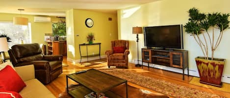 Open Living Room Which Leads To The Dining Area With Gourmet Kitchen Attached