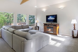 Newly updated living room with Smart TV and electric fireplace.