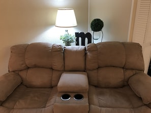 Reclining love seat with cup holders