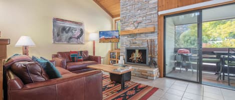 Living Room with Wood Fireplace and Deck