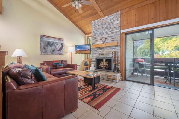 Living Room with Wood Fireplace and Deck