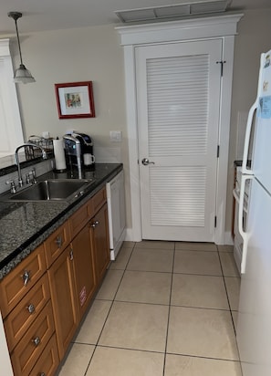 Fully equipped kitchen-stove, microwave, dishwasher--washer/dryer behind door