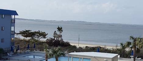 View of pool from the balcony. Northwest facing so you can see the sunset.