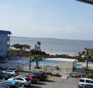 View of pool from the balcony. Northwest facing so you can see the sunset.