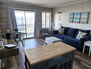 Open dining, kitchen, and living area.