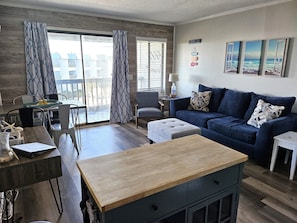 Open dining, kitchen, and living area.