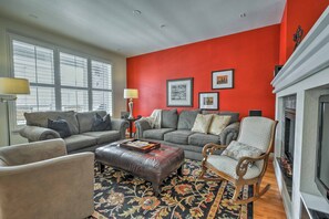 The living area features an electric fireplace and flat-screen cable TV.