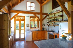 fully equipped farm kitchen with dishwasher and gas range.