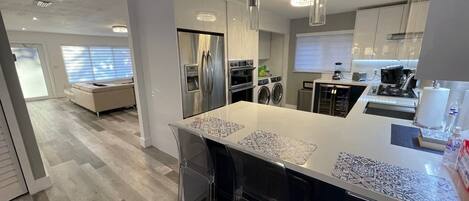 Kitchen leading to living room and front of the house