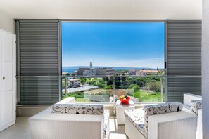 Sunny balcony with outdoor furniture
