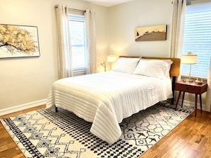 one of the Main floor bedrooms with a Queen bed 