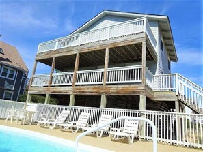 Rear Exterior with Large Decks Overlooking the Pool Area