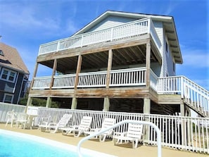 Rear Exterior with Large Decks Overlooking the Pool Area