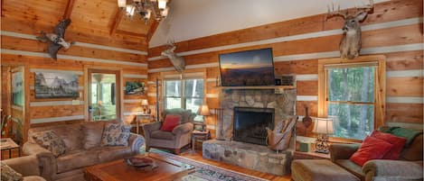 Living Room with HDTV and Stone Wood-burning Fireplace