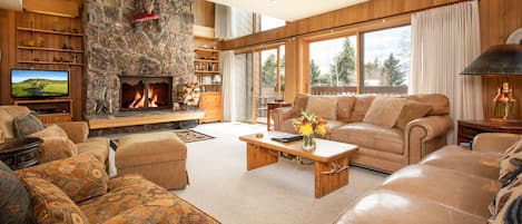 Living Room w/ Fireplace and Deck