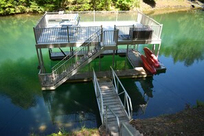 Dock showing chairs and Pelican kayaks.  12' of water under boat, perfect!