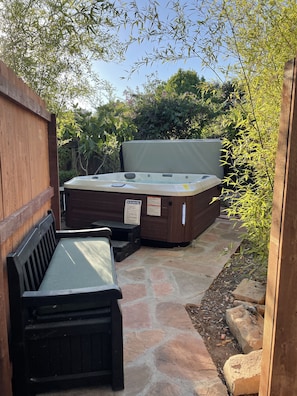 Private enclosed area for jacuzzi.