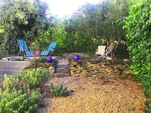 Back garden sunbathe, read and snooze area.