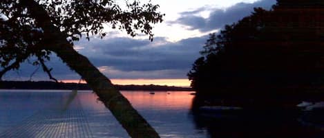 Come enjoy breathtaking sunsets from the front porch of this charming cabin 