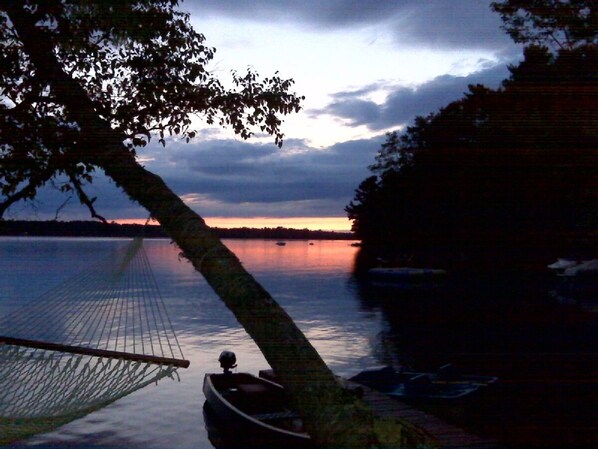 Come enjoy breathtaking sunsets from the front porch of this charming cabin 