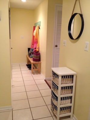 Entry way with bench and hooks for towels, beachbags, and shoes.