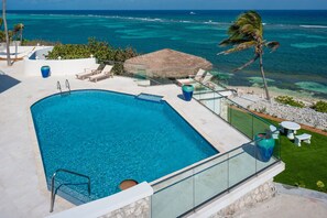 Watch the shores kiss the sand from the pool deck.