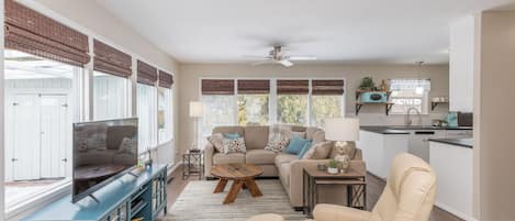 Welcoming and cozy living room overlooking cedar trees in back yard.