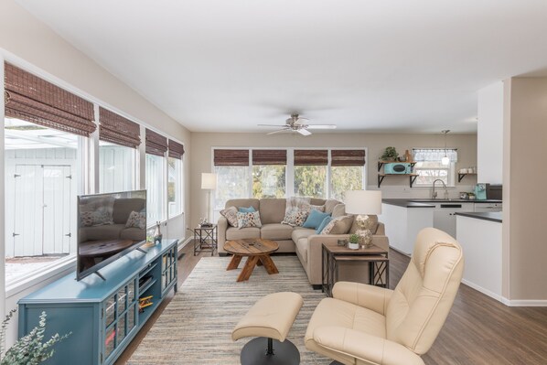 Welcoming and cozy living room overlooking cedar trees in back yard.