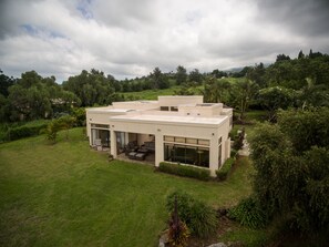 Kula means open meadow. These windows face sunset, ocean. West Mauis, & valley 